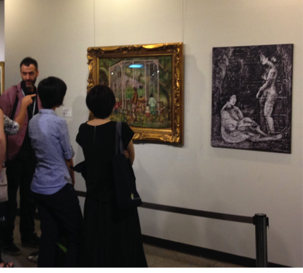 Ioseba presenting a tour of the Chen Cheng-po exhibition at Cheng Shui University.
