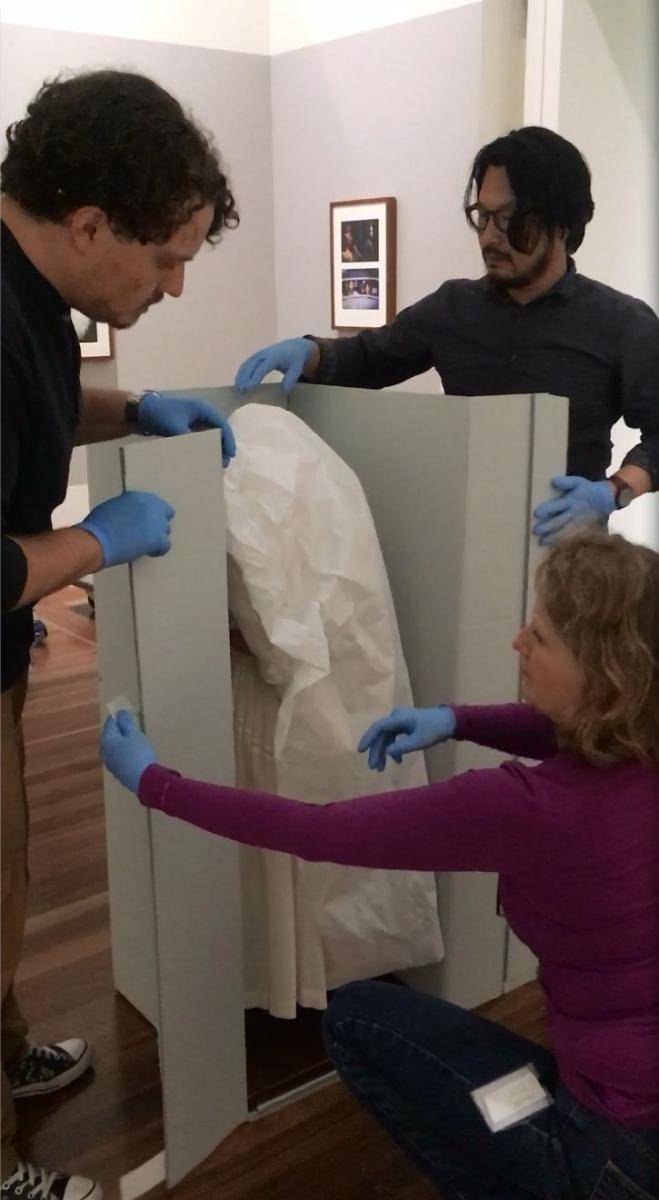 Aaron, Shingo and Victoria setting up dress from Picnic at Hanging Rock. Image: NFSA