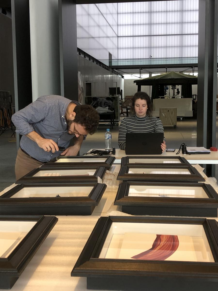 Evaluating artworks at White Rabbit (Photograph of Senior Paintings Conservator Matteo Volonté and Graduate Paintings Conservator Eden Christian; photograph supplied by Adam Godijn, ICS, 1/04/19)