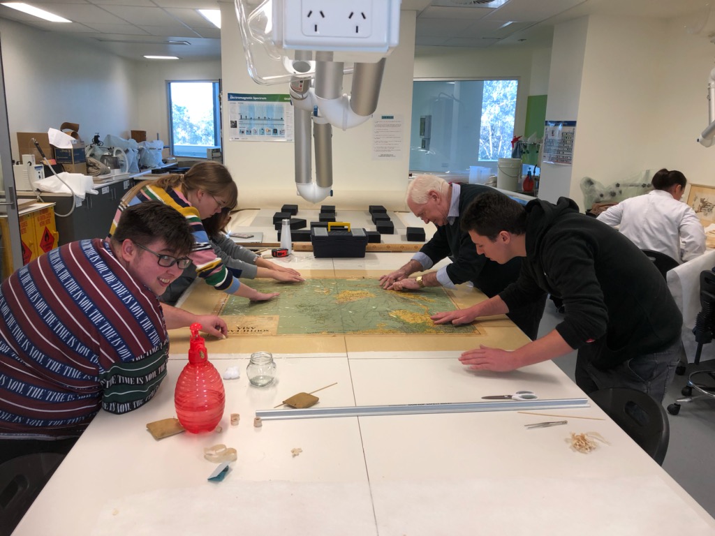 University of Canberra students working on the maps