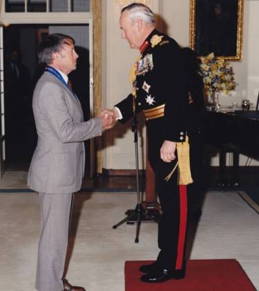 Colin receives his AO from Sir Phillip Harvey Bennett, AC, KBE, DSO, then Governor of Tasmania, in 1994.