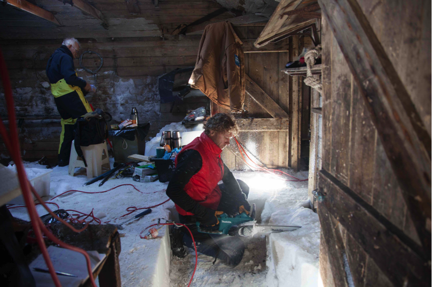 Marty Passingham excavating snow and ice in the workshop (D.Killick 2015)