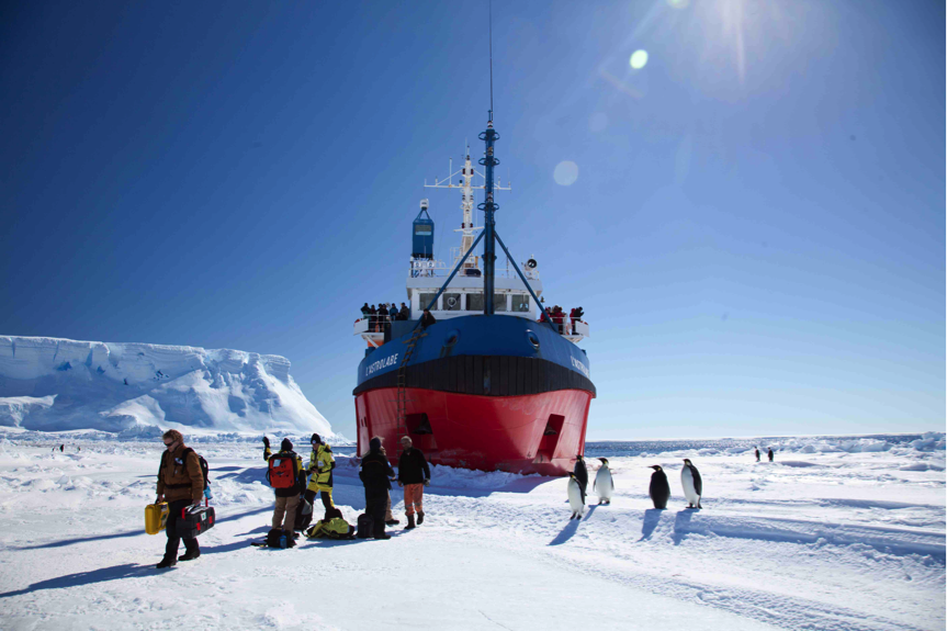 Disembarking from l’Astrolabe surrounded by some interested Emperor Penguins (D.Killick 2015)