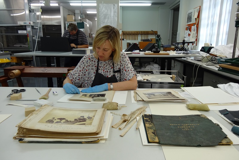 Elizabeth Mayfield working on Governor Buxton’s Family Album. Image: Artlab