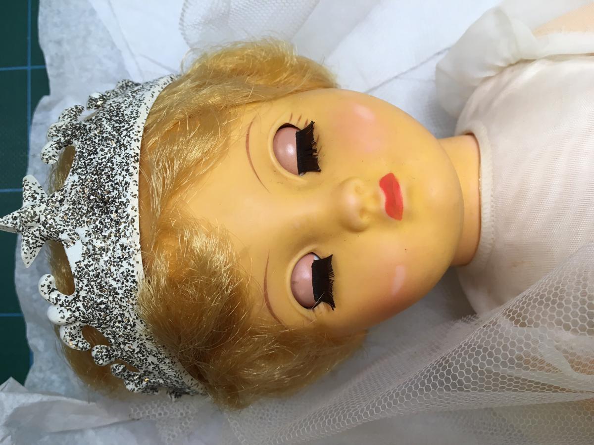 Pedibye Bride doll made by Australian company Moldex Ltd in the 1950s. The doll’s body has become orange in colour. Body polymer identified via FTIR-ATR as polyvinyl chloride. The spectrum also indicates a phthalate plasticizer.