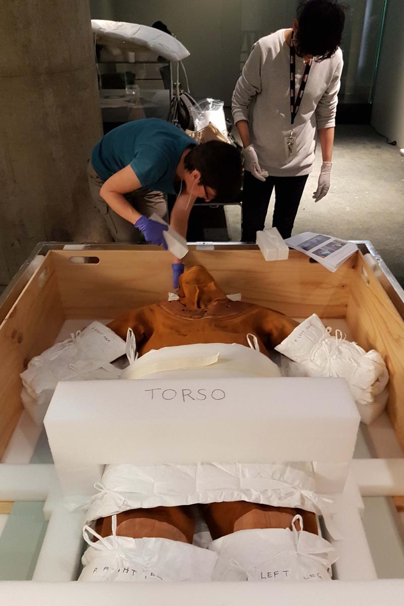 Carmela Corvaia and Anupa Shah packing objects from Lustre. Image by ANMM.
