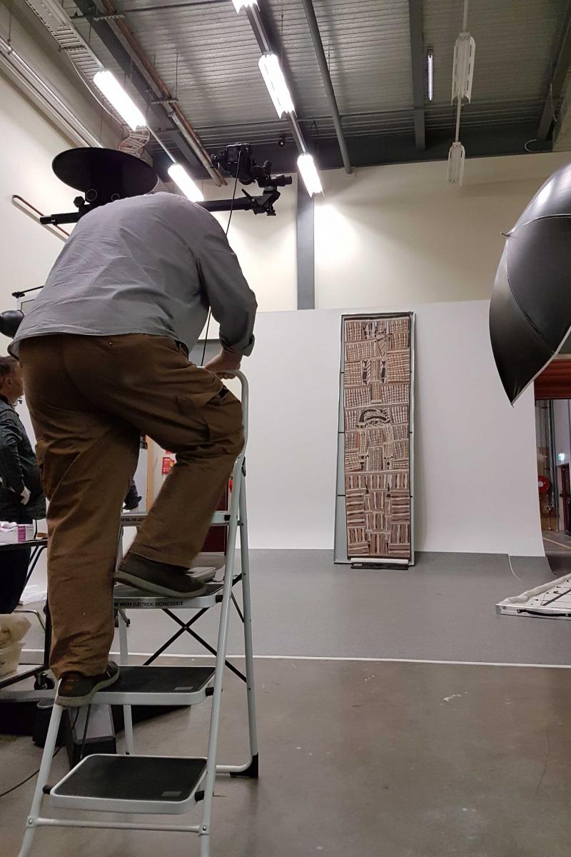 Andrew Frolows photographing the 3.7m bark painting. Image N. Flood.