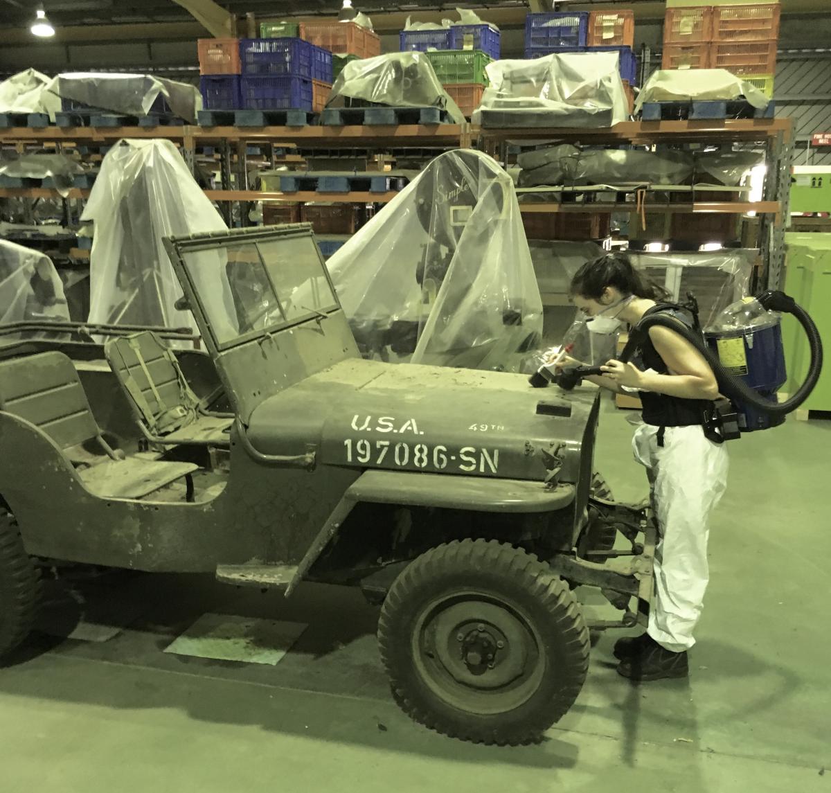 ‘E.Urrutia-Bernard brush vacuuming Willy’s Army Jeep’ photo by A.Van Papenrecht