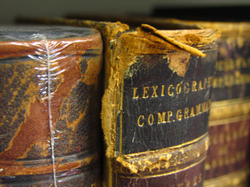 The top of book spines often become weak and torn, as they are repeatedly pulled from the shelves by this edge. Photo courtesy of the State Library of Victoria.