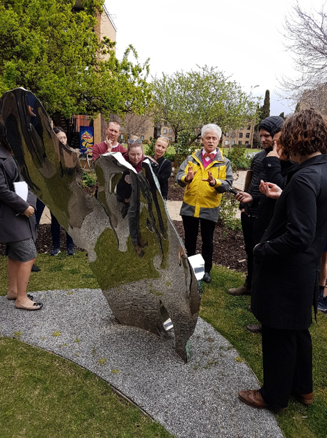 Ian leads a discussion on the sculpture collection at Trinity College, University of Melbourne. Image by N. Flood.