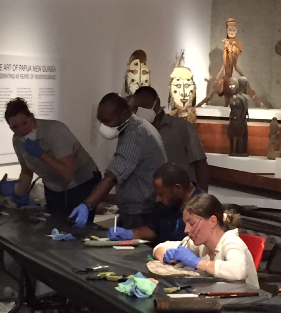 Fran Paterson demonstrating cleaning techniques at the National Museum and Art Gallery of Papua New Guinea