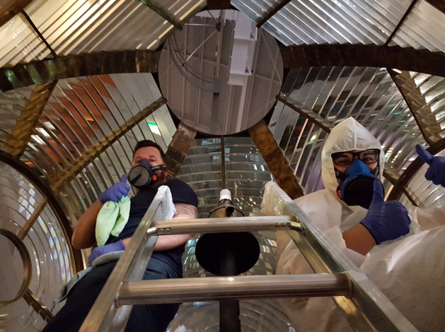 Thumbs up from Jeff Fox and Lucilla Ronai while cleaning the inside of the Tasman Light. Image by N. Flood.