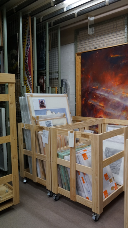 Canvases and Framed Works in the trolleys...