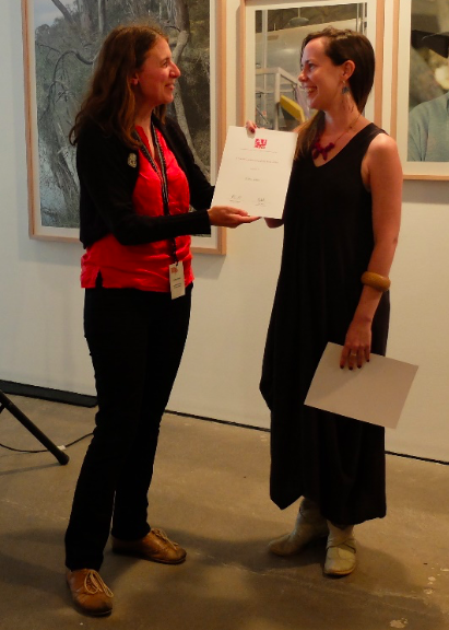 Katie Wood (Membership Services Officer, AICCM) presenting the Conservator of the Year award to Kelly Leahey