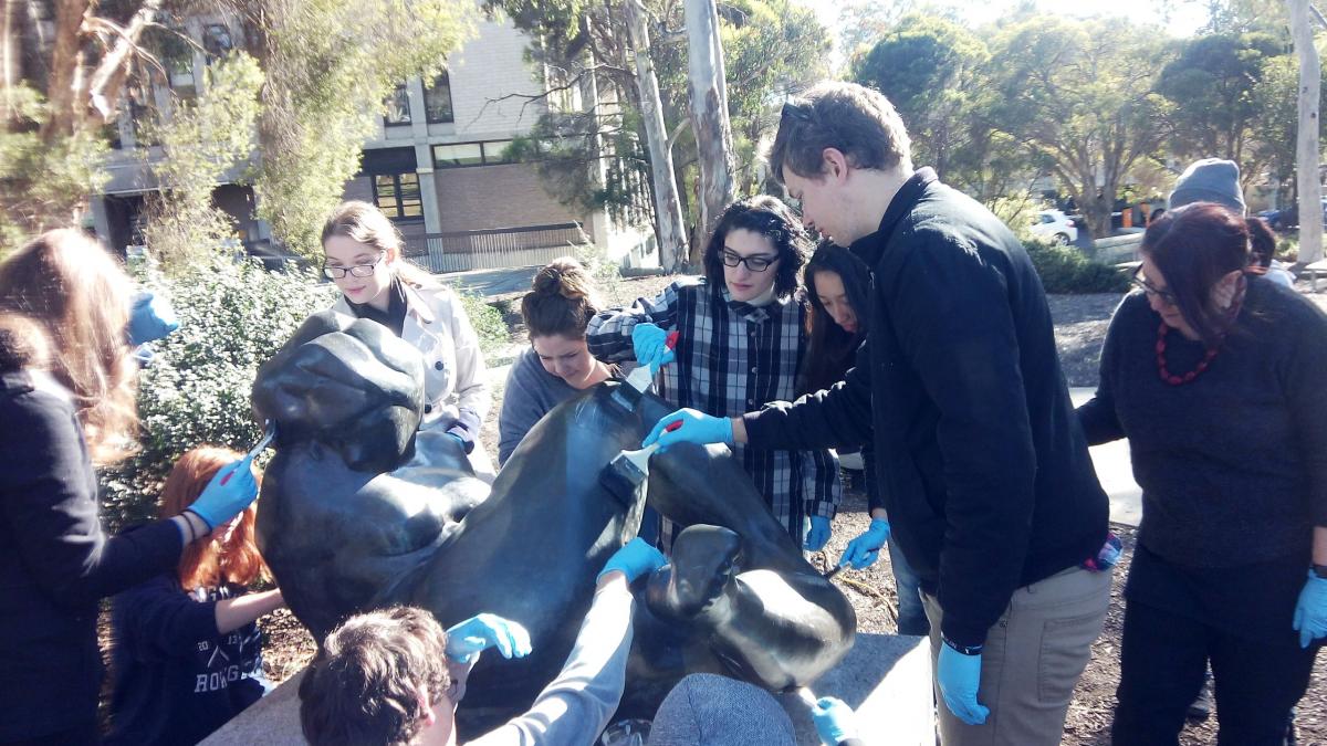 Figure 2. UC heritage conservation students hard at work waxing the Reclining Figure. Photo: Mona Soleymani