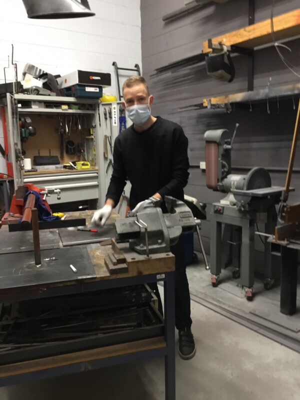 Adam in the welding workshop. 