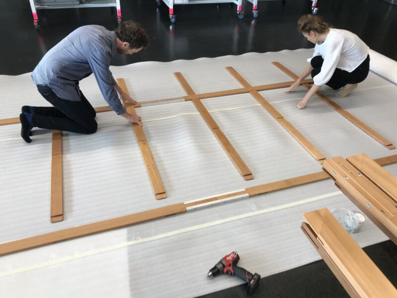 Alex Forrest and Emily Kelleher assemble the oversized stretcher.