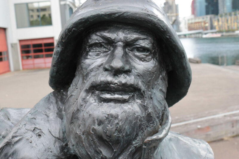close up of bronze sculpture of sailor's face