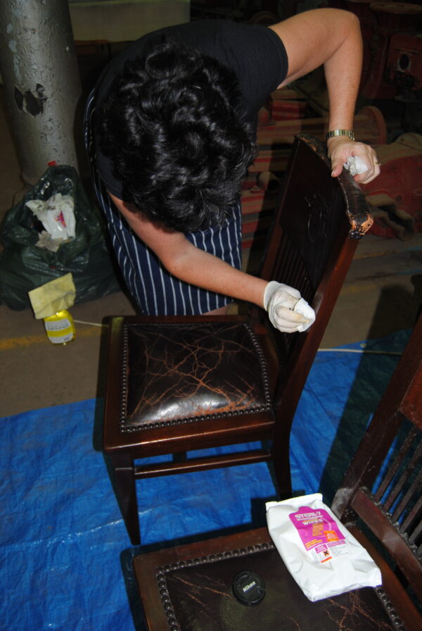 Chair being cleaned by conservator
